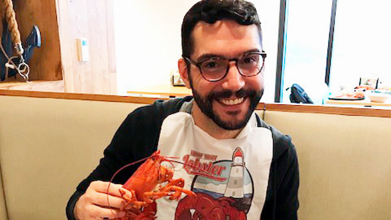 Green Lab member eating lobster