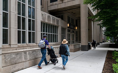 People walking outside the Searle building