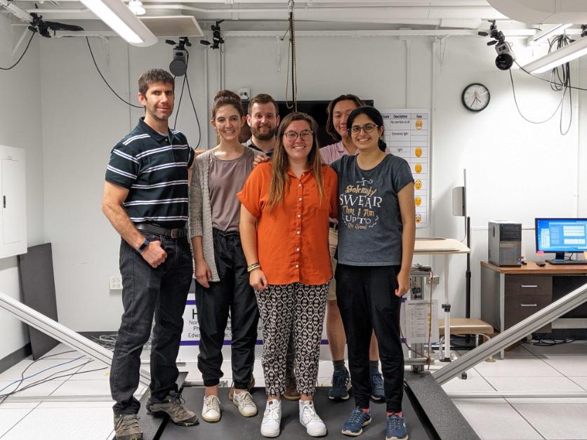 Members posing and smiling in the lab
