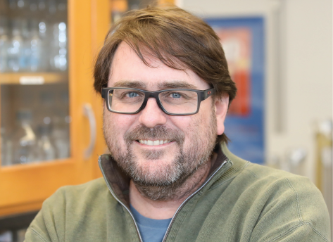 headshot of Brian Mitchell, PhD, in lab