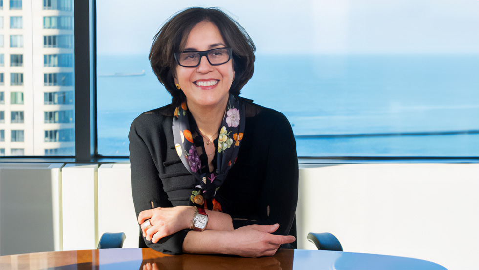 Dr. Sorond sits at her desk